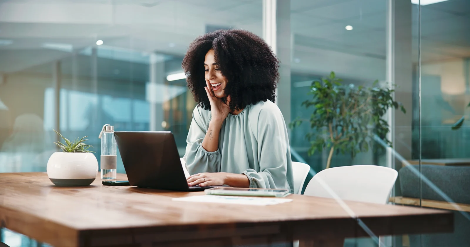 Woman on a phone call at her desk – online psychiatry in Albuquerque, NM